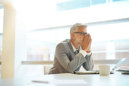 Man frustrated at computer