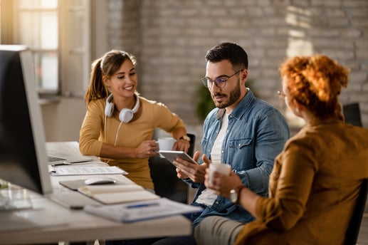 team-young-entrepreneurs-having-business-meeting-office-focus-is-businessman-using-digital-tablet