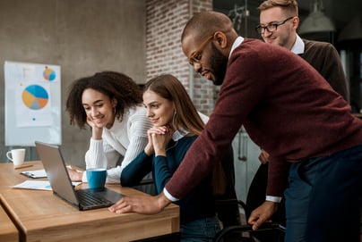 woman-showing-something-her-colleagues-during-meeting